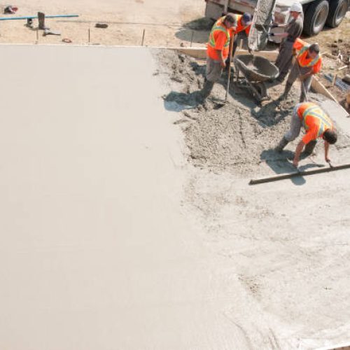 jm pros concrete foundation 3 Workers installing and smoothing a concrete foundation in East Valley, AZ